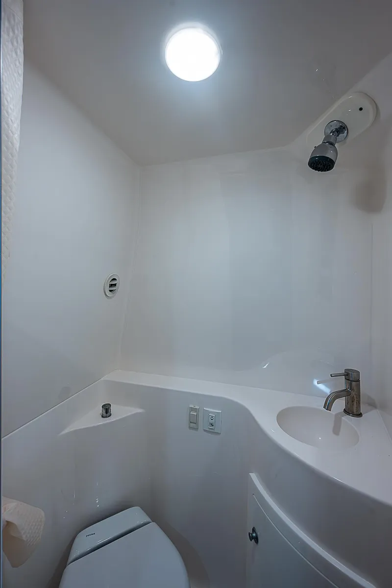 Slide: The Image of 2022 Regal 26 XO boat bathroom with modern fixtures and lighting. - 7