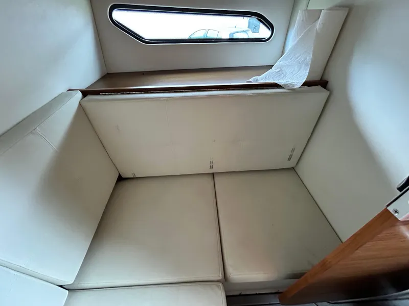 Slide: The Image of Interior cabin of 2017 Cruisers Yachts 338 Sport Series with cushioned seating. - 11