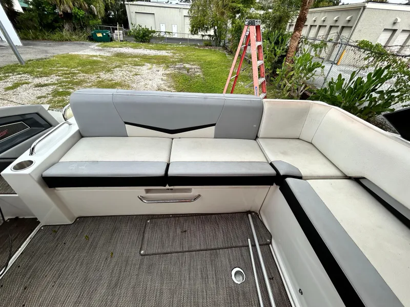 Slide: The Image of 2017 Cruisers Yachts 338 Sport Series interior seating area with gray and white upholstery. - 14