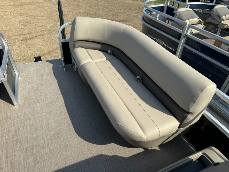 Slide: The Image of 2025 Sun Tracker Party Barge 16 DLX with beige seating on deck. - 11