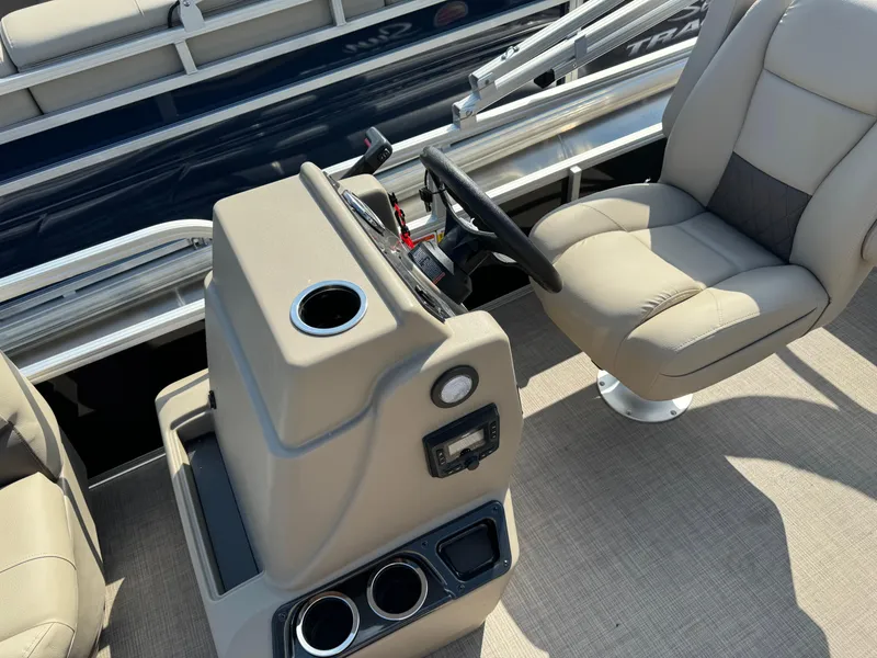Slide: The Image of 2025 Sun Tracker Party Barge 16 DLX interior with steering console and seating. - 15