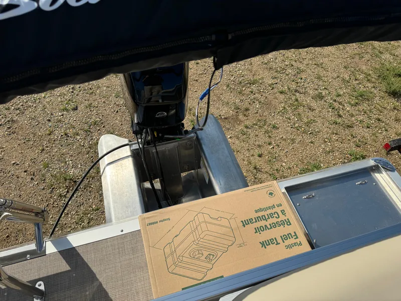 Slide: The Image of Sun Tracker Party Barge 16 DLX 2025 with fuel tank box on deck. - 18