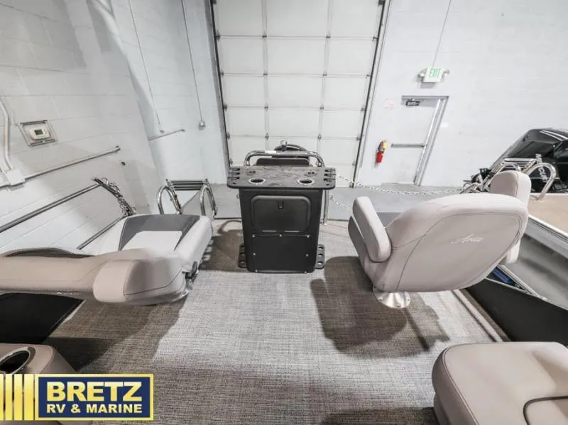 Slide: The Image of Interior of 2025 Aria Cast-N-Cruise A22CC boat with seating and control panel. - 13
