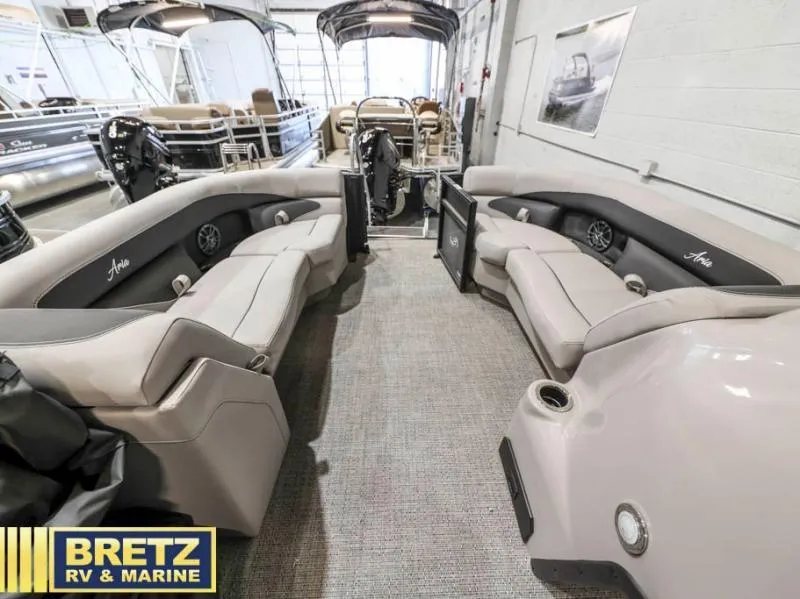 Slide: The Image of 2025 Aria Cast-N-Cruise A22CC pontoon boat interior at Bretz RV & Marine showroom. - 14