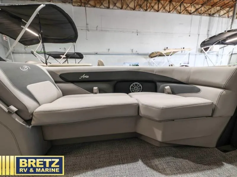 Slide: The Image of 2025 Aria Cast-N-Cruise A22CC boat interior with plush seating at Bretz RV & Marine. - 15