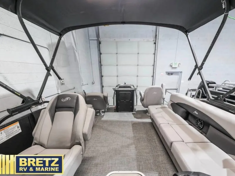 Slide: The Image of 2025 Aria Cast-N-Cruise A22CC boat interior with seating, showcased at Bretz RV & Marine. - 18
