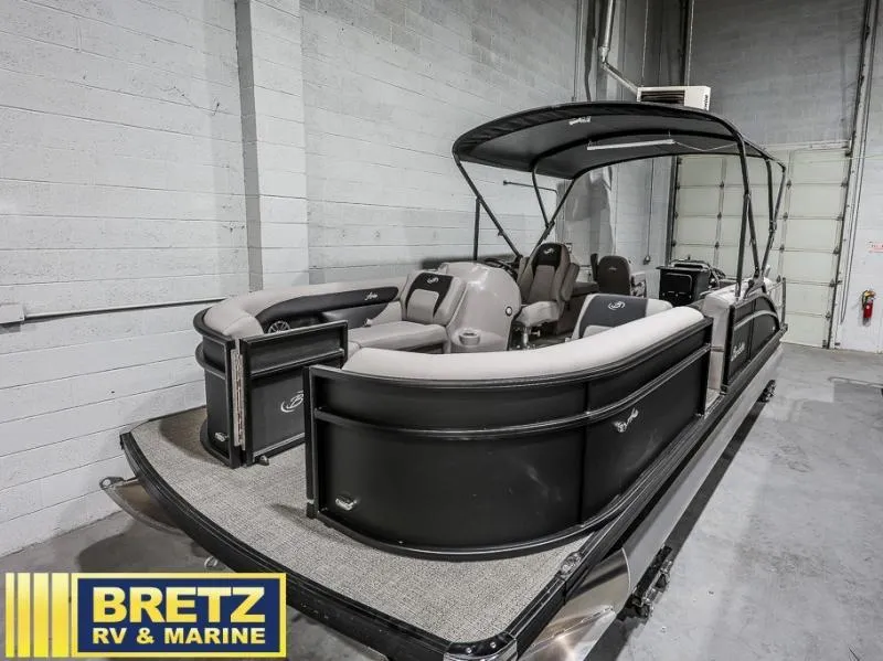 Slide: The Image of 2025 Aria Cast-N-Cruise A22CC pontoon boat in showroom, Bretz RV & Marine. - 4