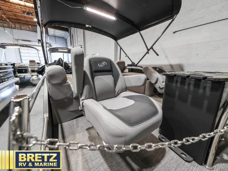 Slide: The Image of 2025 Aria Cast-N-Cruise A22CC boat interior with seating, displayed at Bretz RV & Marine. - 8