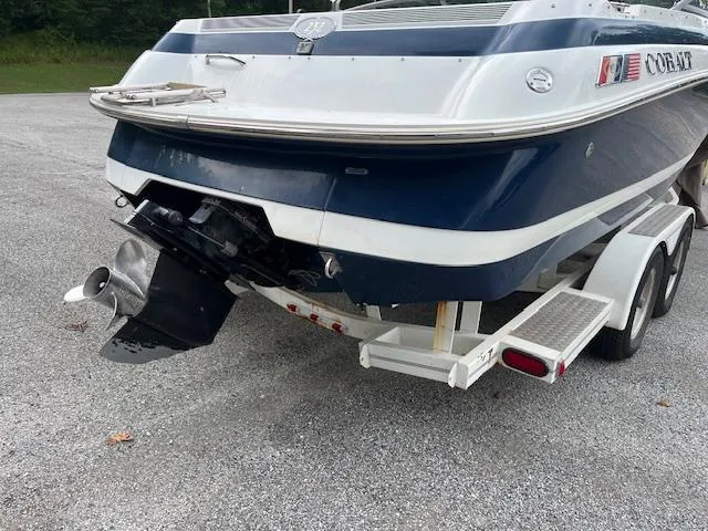 Slide: The Image of 1996 Cobalt 232 boat on trailer, rear view, blue and white design. - 3