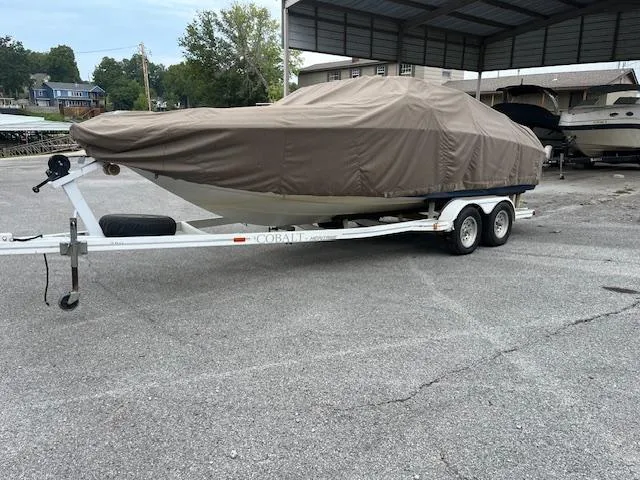 Slide: The Image of Covered 1996 Cobalt 232 boat on trailer in parking area. - 4