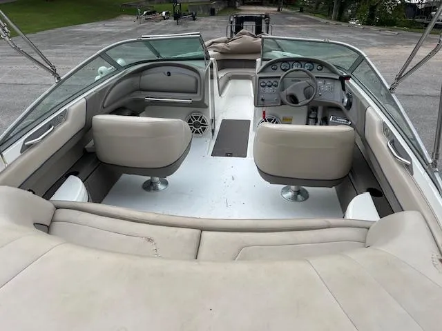 Slide: The Image of Interior of a 1996 Cobalt 232 boat with beige seating and dashboard. - 5