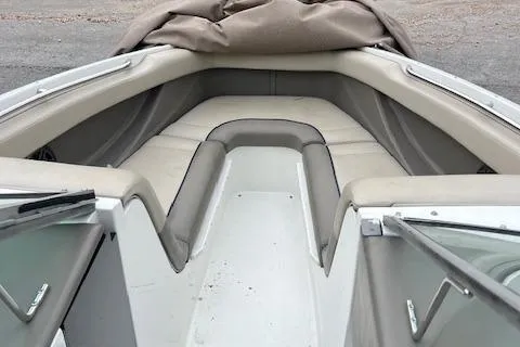 Slide: The Image of Interior view of a 1996 Cobalt 232 boat with beige seating. - 8