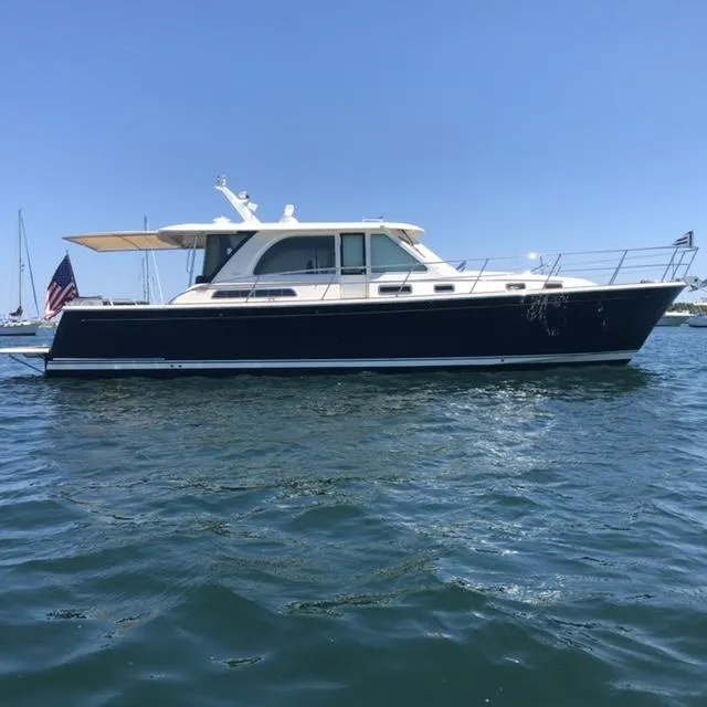 Slide: The Image of 2018 Sabre 45 Salon Express yacht on open water, side view. - 1