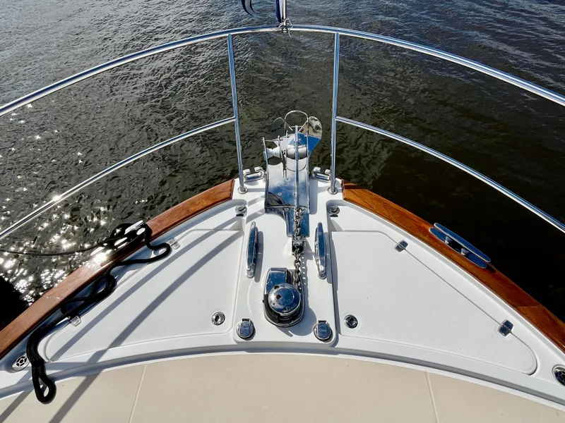 Slide: The Image of 2018 Sabre 45 Salon Express yacht bow with polished anchor and railing. - 18