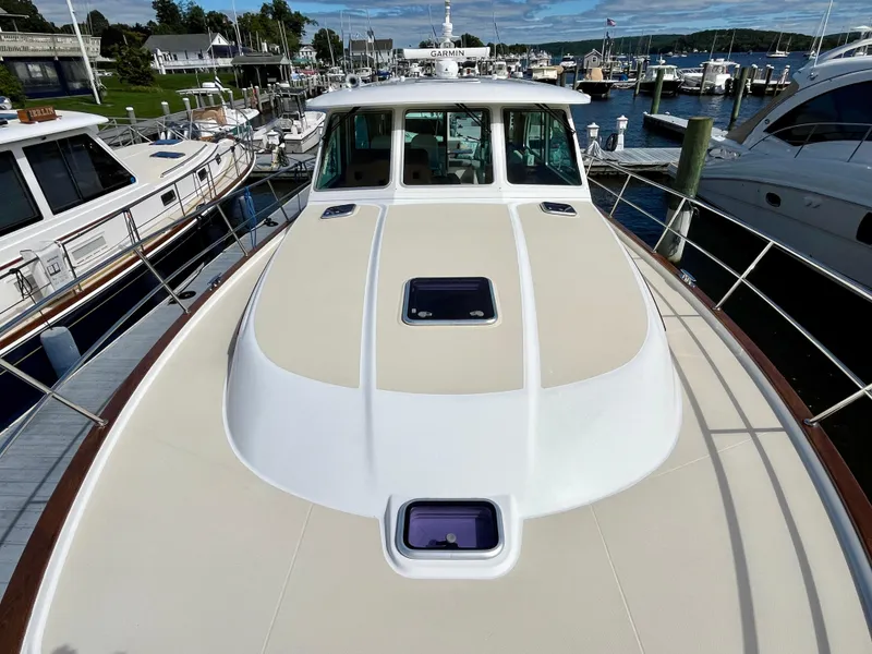 Slide: The Image of 2018 Sabre 45 Salon Express yacht docked at marina, top deck view. - 19