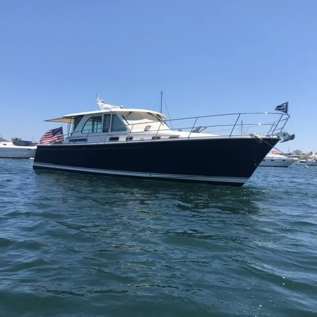 Slide: The Image of 2018 Sabre 45 Salon Express yacht on calm water, sunny day. - 2