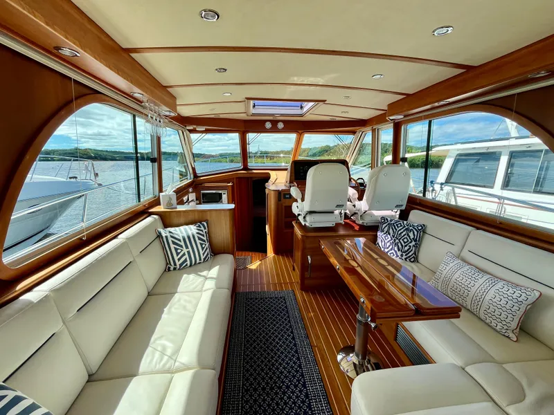 Slide: The Image of Interior of 2018 Sabre 45 Salon Express yacht with luxurious seating and wood finishes. - 24