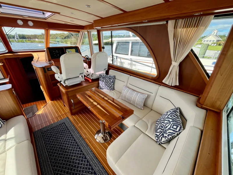 Slide: The Image of Interior of 2018 Sabre 45 Salon Express yacht with elegant seating and wooden finishes. - 25