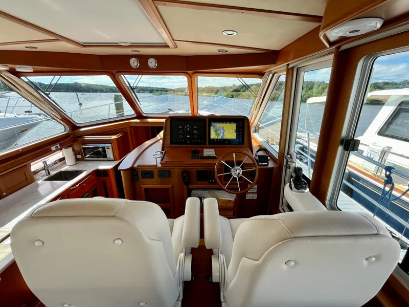 Slide: The Image of Interior of 2018 Sabre 45 Salon Express yacht with helm and navigation system. - 30