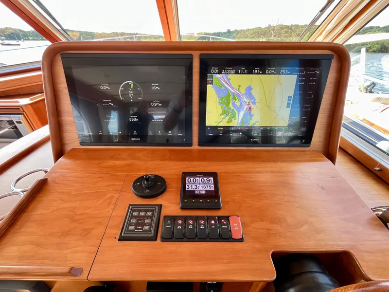 Slide: The Image of 2018 Sabre 45 Salon Express dashboard with navigation and control screens. - 32