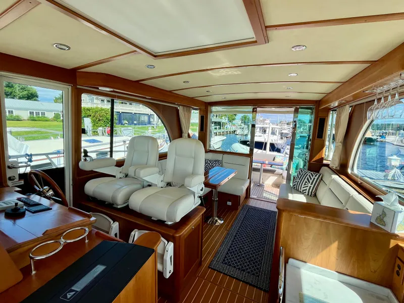 Slide: The Image of Interior of 2018 Sabre 45 Salon Express yacht with luxurious seating and wood finishes. - 34