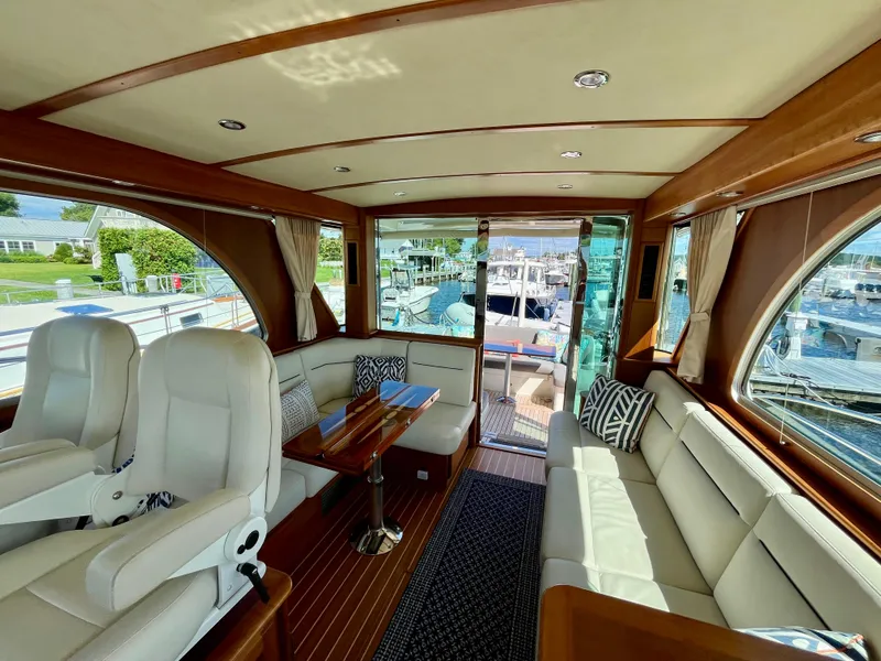 Slide: The Image of Luxurious interior of 2018 Sabre 45 Salon Express yacht with plush seating and wood accents. - 35