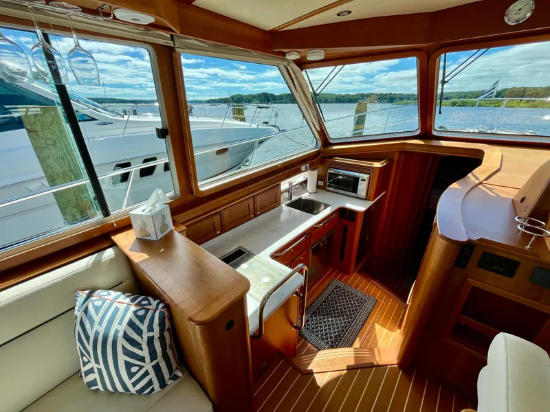 Slide: The Image of Interior of 2018 Sabre 45 Salon Express yacht with wood finish and scenic view. - 36