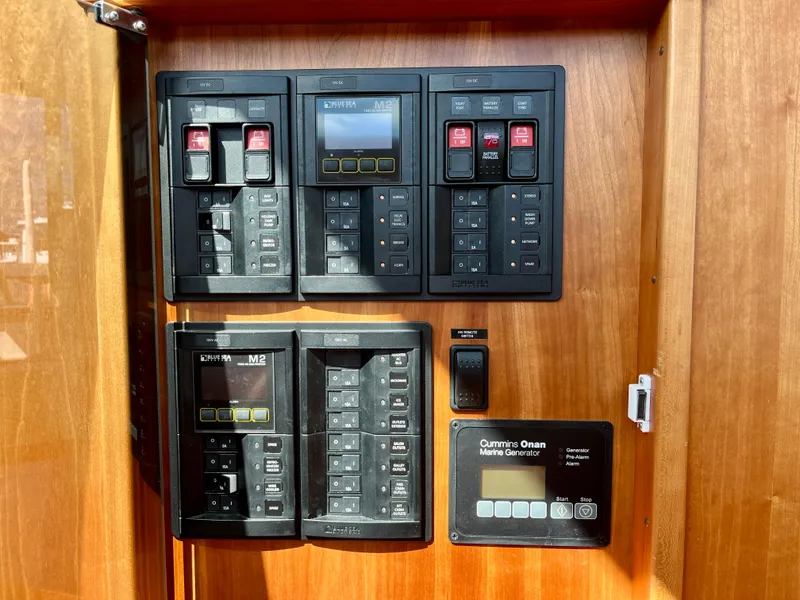 Slide: The Image of Electrical panel of 2018 Sabre 45 Salon Express yacht with Cummins Onan Marine Generator. - 43