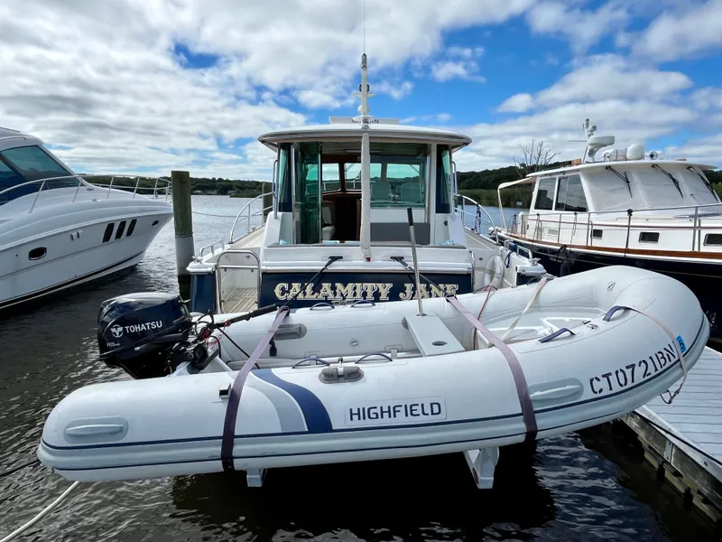 Slide: The Image of 2018 Sabre 45 Salon Express with Highfield dinghy at marina. - 8