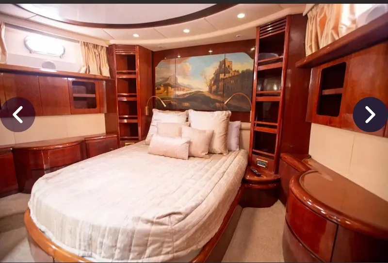 Slide: The Image of Luxurious bedroom interior of 2003 Azimut 74 Solar yacht with elegant wood finishes. - 10