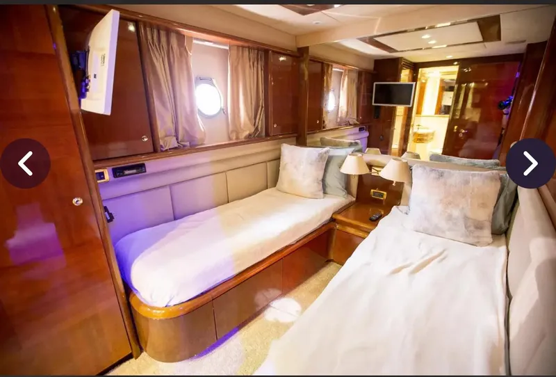 Slide: The Image of Luxurious cabin interior of 2003 Azimut 74 Solar yacht with twin beds and elegant decor. - 11