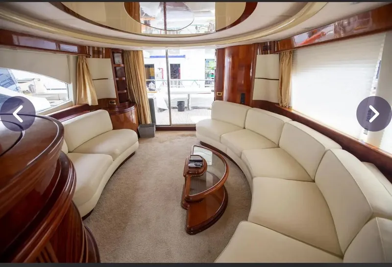Slide: The Image of Luxurious interior of 2003 Azimut 74 Solar yacht with elegant cream seating and wood accents. - 12