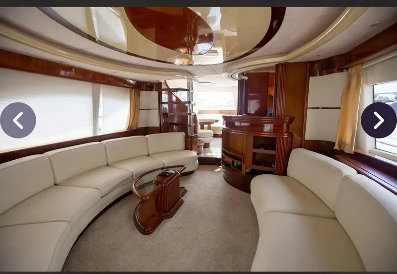 Slide: The Image of Luxurious interior of a 2003 Azimut 74 Solar yacht with elegant seating and wood accents. - 15