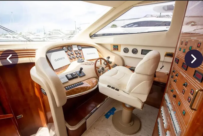 Slide: The Image of Luxurious 2003 Azimut 74 Solar yacht helm with advanced navigation controls. - 16