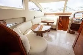 Slide: The Image of Luxurious interior of 2003 Azimut 74 Solar yacht with elegant seating and wooden accents. - 6