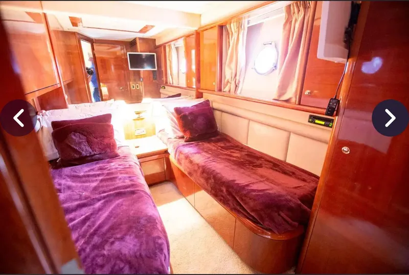 Slide: The Image of Luxurious cabin interior of 2003 Azimut 74 Solar yacht with twin beds and rich wood finishes. - 8