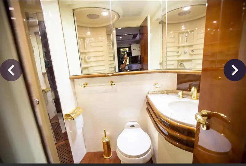 Slide: The Image of Luxurious bathroom in 2003 Azimut 74 Solar yacht with gold accents and elegant fixtures. - 9