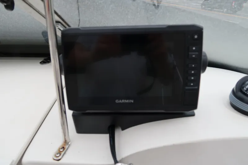 Slide: The Image of Garmin GPS device on 2004 Stingray 240 CS boat dashboard. - 20