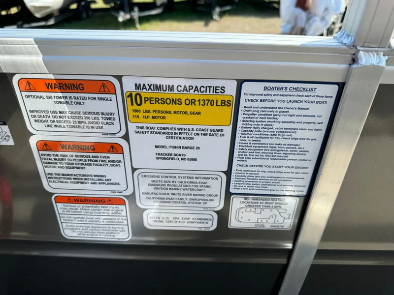 Slide: The Image of 2025 Sun Tracker Fishin' Barge 20 DLX capacity and safety labels, maximum 10 persons or 1370 lbs. - 20