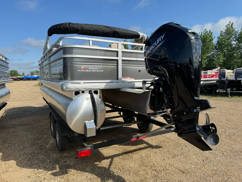 Slide: The Image of 2025 Sun Tracker Fishin' Barge 20 DLX pontoon boat with Mercury outboard motor. - 5