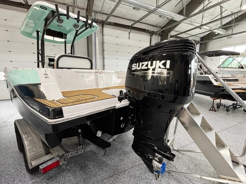 Slide: The Image of 2025 Starcraft SVX 231 OB CC boat with Suzuki outboard motor. - 24