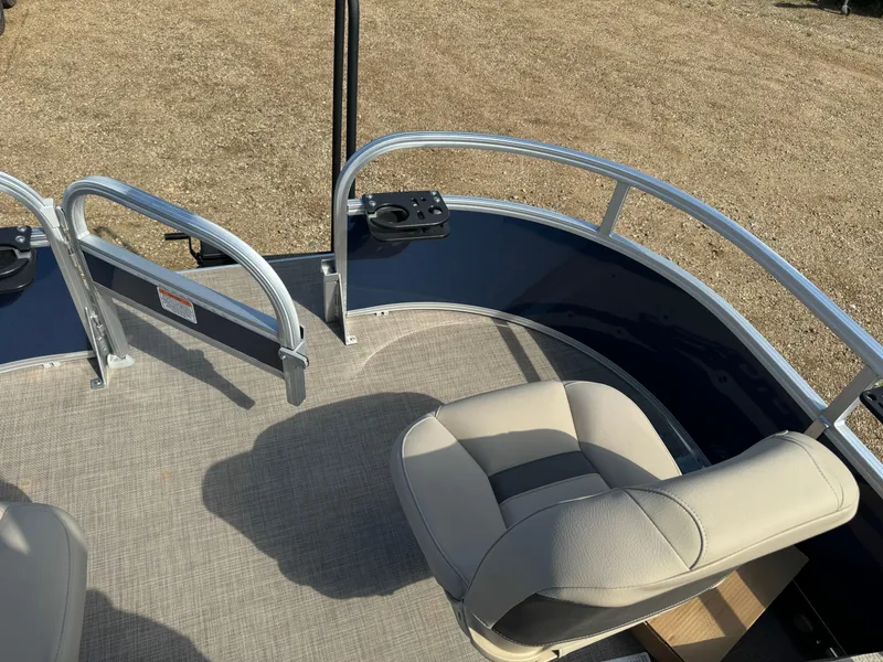 Slide: The Image of 2024 Sun Tracker Bass Buggy 16 XL Select pontoon boat interior with seating and railing. - 6