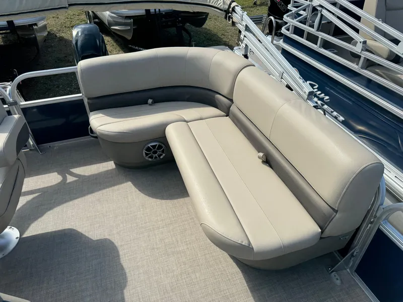 Slide: The Image of 2024 Sun Tracker Bass Buggy 16 XL Select pontoon boat with beige seating. - 7