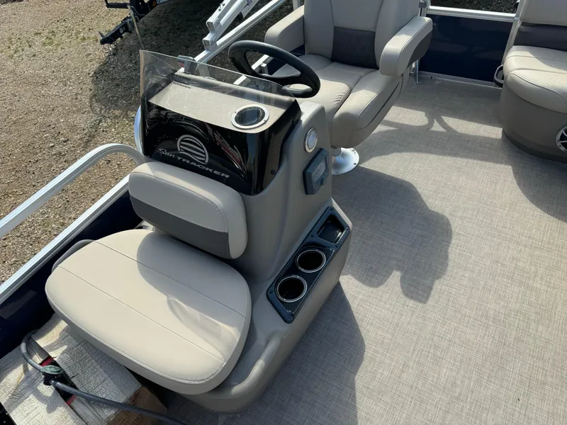Slide: The Image of 2024 Sun Tracker Bass Buggy 16 XL Select boat interior with steering console and seating. - 8