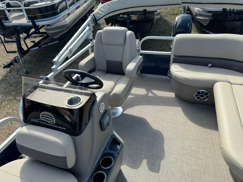 Slide: The Image of 2024 Sun Tracker Bass Buggy 16 XL Select interior with comfortable seating and steering console. - 9