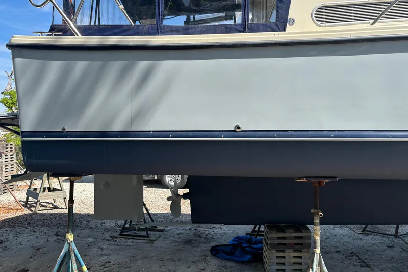 Slide: The Image of Atlas Boat Works Acadia 32, 2004 model, propped up for maintenance. - 18