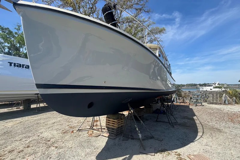 Slide: The Image of 2004 Atlas Boat Works Acadia 32 yacht on stands outdoors. - 19