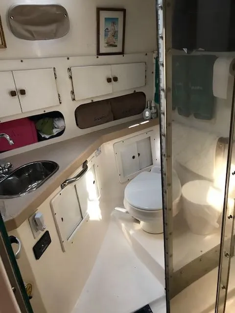 Slide: The Image of 2004 Acadia 32 yacht interior featuring bathroom and storage. - 7