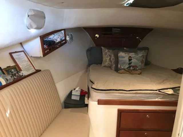 Slide: The Image of Interior of a 2004 Atlas Boat Works Acadia 32 with cozy bed and seating area. - 8