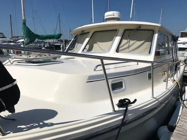 Slide: The Image of Atlas Boat Works Acadia 32, 2004 model, docked at marina. - 4